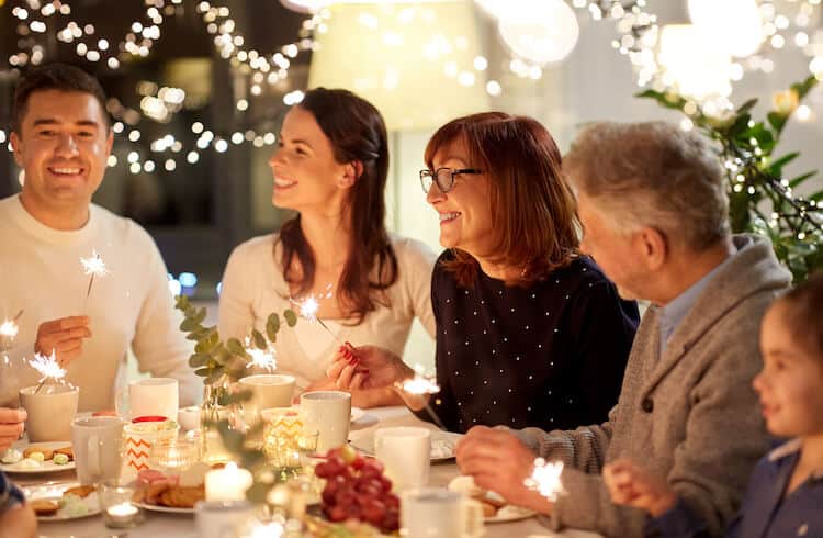 Family gathering at the table to share a holiday meal.