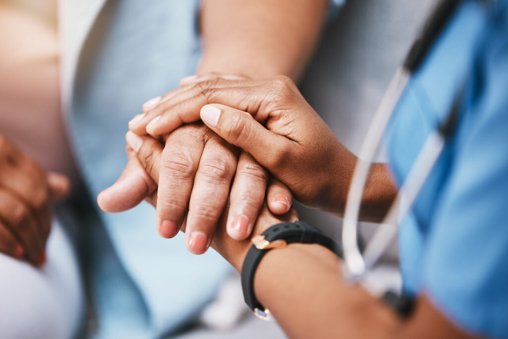 holding hands with patients